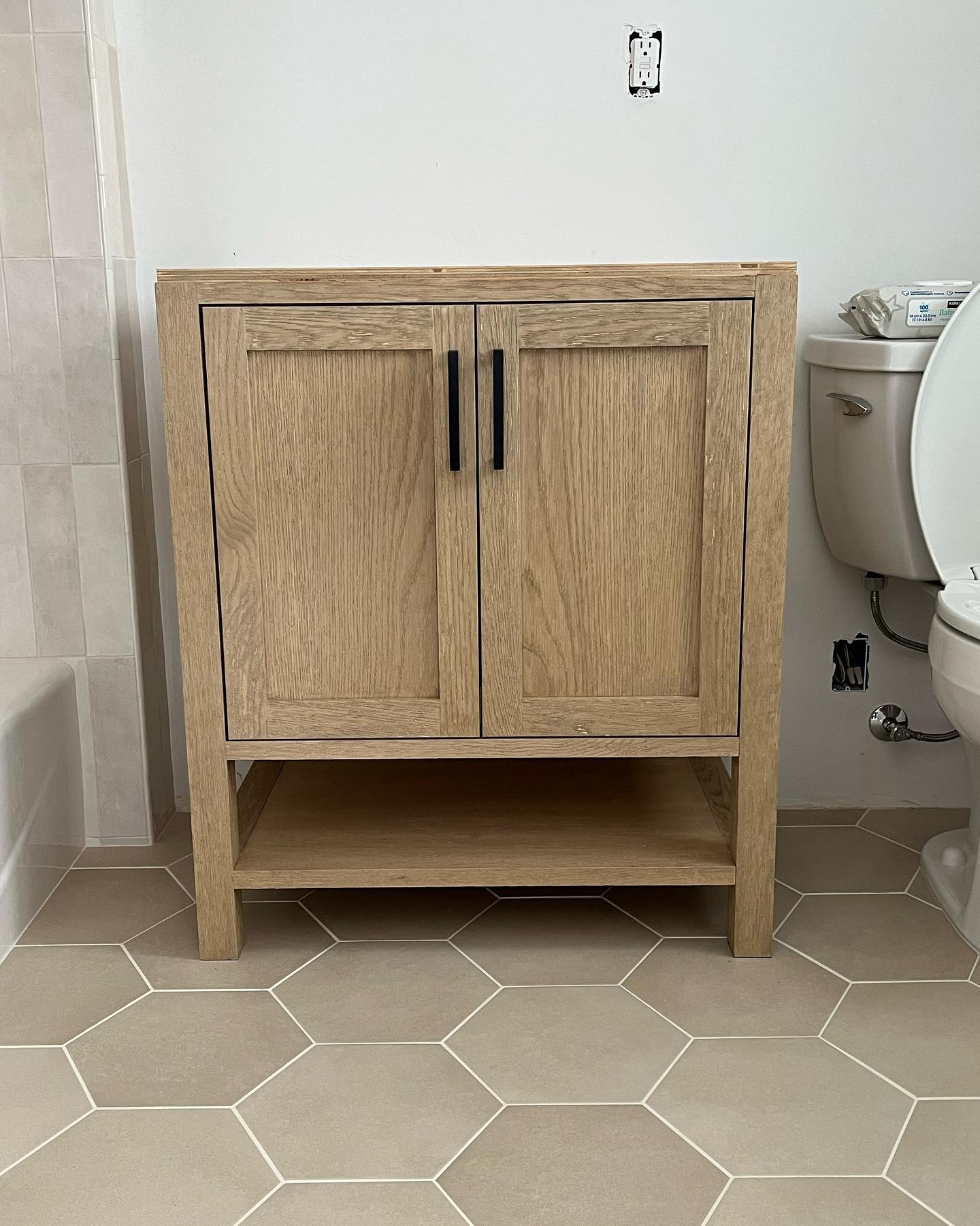 Featured image for “Custom white oak vanity with inset doors. Wire brushed texture”